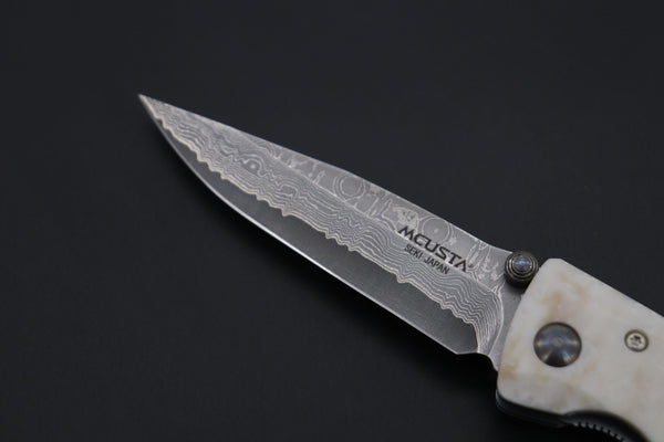 Mcusta Classic Wave Series MC-19D VG-10 Damascus blade with Dupont Corian handle - japaneseknifedirect.mom