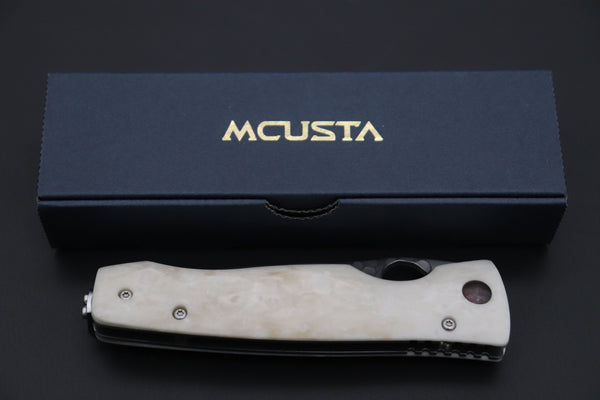 Mcusta Tactility Elite Folder Series MC-126G SPG-2 San Mai blade with Dupont Corian handle - japaneseknifedirect.mom
